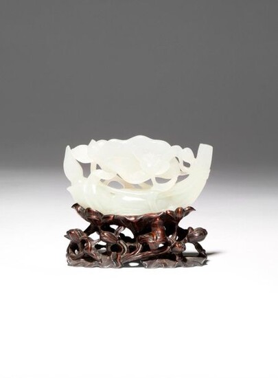 A CHINESE WHITE JADE 'LOTUS' CARVING 18TH CENTURY Carved in...