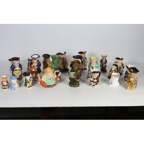 A COLLECTION OF TWENTY TWO TOBY JUGS to include a Clarice Cl...