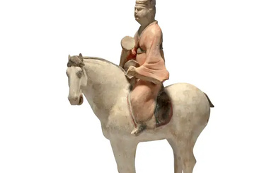A Chinese pottery figure of a musician on horseback Tang dynasty The...
