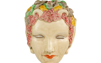 A Clarice Cliff Pan or Puck wall mask.