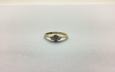 A Dainty Antique Four Stone Ring, collet set, stamped "18ct ...