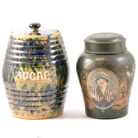 A Dark Shag stoneware shop tobacco jar with tin lid and a majolica glaze sugar jar.