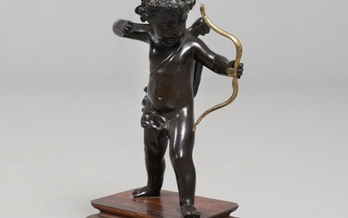 A FRENCH BRONZE STUDY OF CUPID. 19th century, modelled in st...