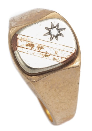 A GENT 9CT GOLD DIAMOND SIGNET RING; 2 tone gold top star set with a small round brilliant cut diamond, size T, wt. 4.35g.
