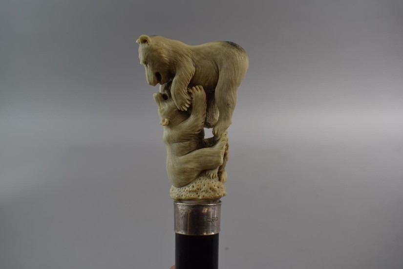 A Gents Ebonised Thornwood Walking Cane with Carved Antler F...
