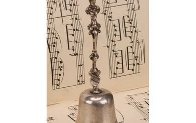 A George V silver table bell, cast figural handle, 14cm high...