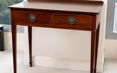 A Georgian mahogany side table with two drawers and spade...