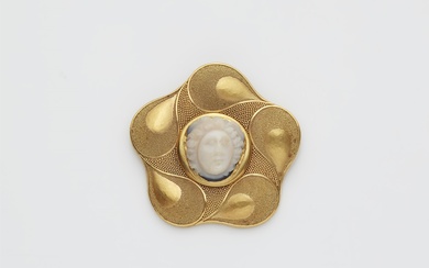A German 18/21k gold and granulation brooch with an ancient Roman layered onyx cameo of a Medusa head.