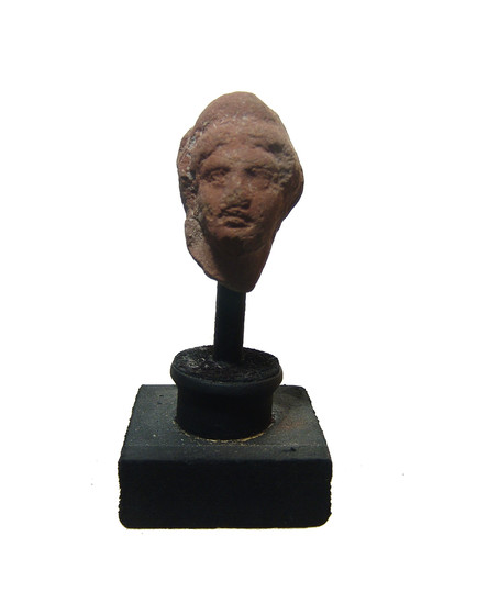 A Greek terracotta head of a woman, Egypt