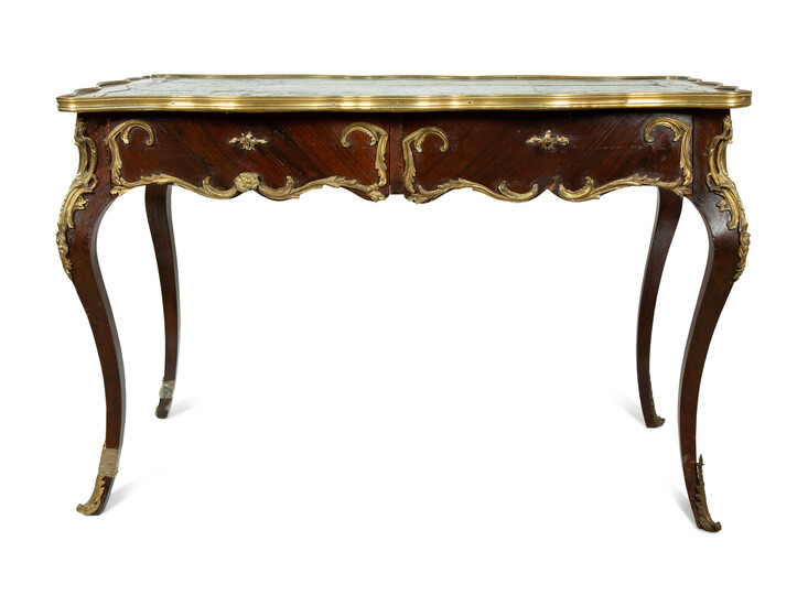 A Louis XV Style Gilt Bronze Mounted and Leather Inset Writing Desk
