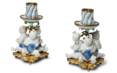 A PAIR OF EUROPEAN-ORMOLU-MOUNTED CANDLEHOLDERS WITH CHINESE PORCELAIN 'BOYS' The...