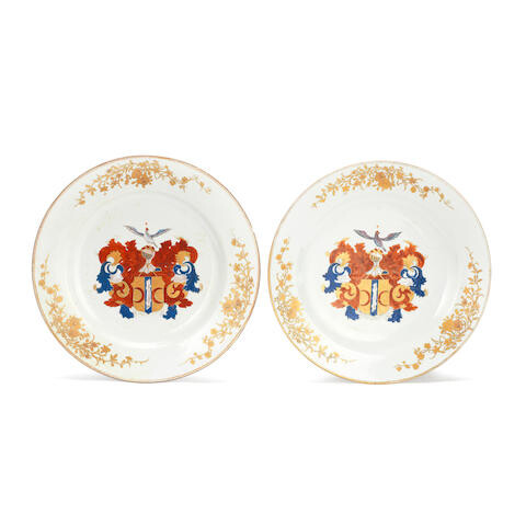 A PAIR OF FAMILLE ROSE 'DUTCH MARKET' ARMORIAL DISHES