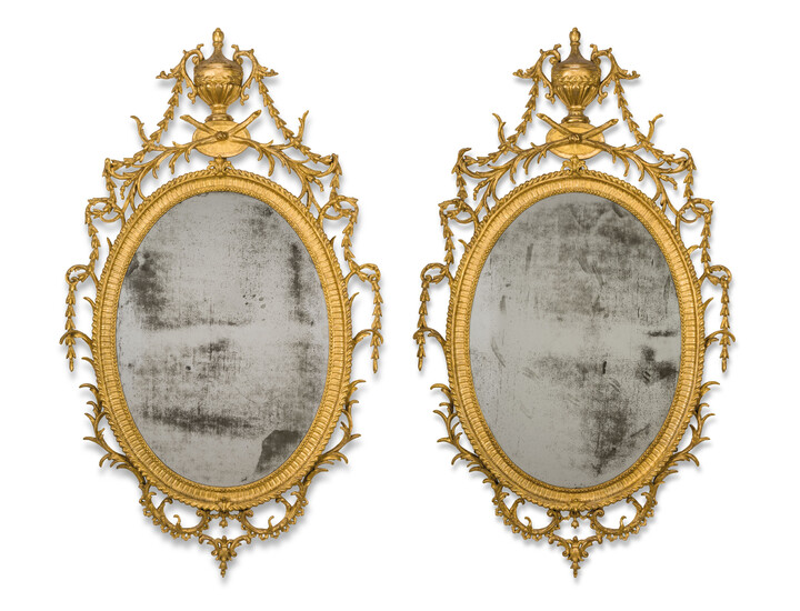 A PAIR OF GEORGE III GILTWOOD AND CARTON PIERRE OVAL MIRRORS