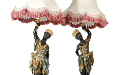 A PAIR OF ITALIAN GILT AND POLYCHROME DECORATED PINE BLACKAMOOR TORCHERES