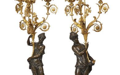 A PAIR OF LOUIS XVIII ORMOLU AND PATINATED BRONZE THREE-BRANCH...