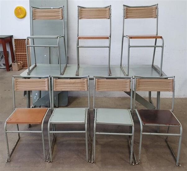 A PAIR OF TRESTLE TABLES AND SEVEN STACKABLE CHAIRS