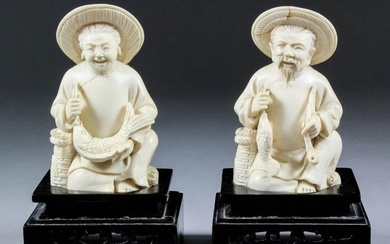 A Pair of Chinese Carved Ivory Seated Figures of...