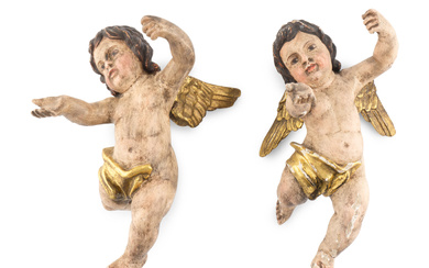 A Pair of Continental Painted and Parcel Gilt Putto Ornaments