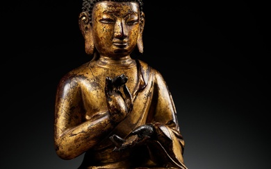 A RARE GILT LACQUERED BRONZE FIGURE OF BUDDHA, INSCRIBED JINGANG BUHUAI FO (BUDDHA OF ADAMANTINE...