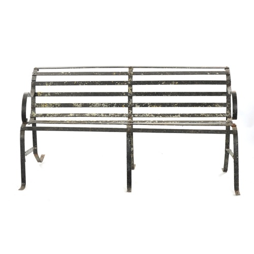 A REGENCY PAINTED CAST IRON GARDEN BENCH with scrolled back ...