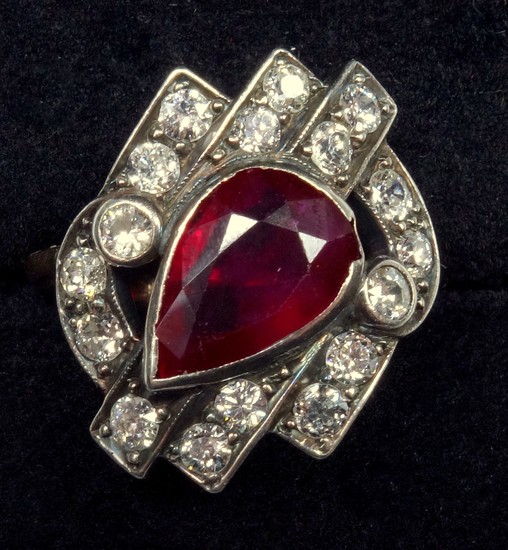 A RUBY AND DIAMOND DRESS RING, PEAR CUT RUBY WEIGHING AN EST...