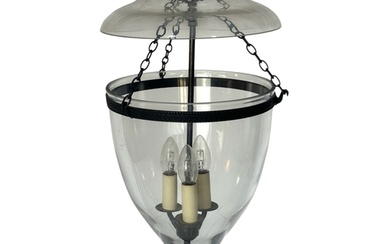 A Regency style Vaughan 'Glass Globe' hall lantern In a dark...