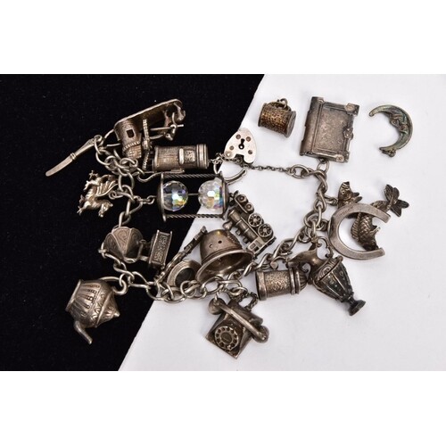 A SILVER CHARM BRACELET AND TO SINGLE CHARMS, the curb link ...