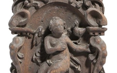 A SMALL CARVED OAK CARTOUCHE PANEL PROBABLY LATE...