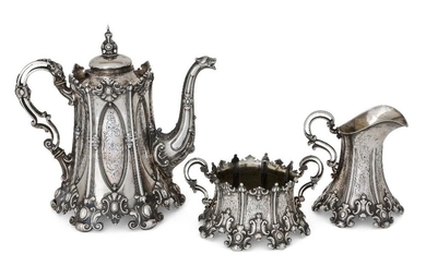 A Swedish silver three-piece tea set, Stockholm, 1908, Guldsmedsaktiebolaget, each piece richly decorated with cast and chased scroll motifs, the teapot with zoomorphic spout and pointed finial, the openwork scroll handle with ivory spacers...