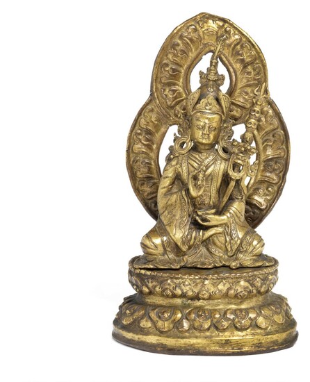 NOT SOLD. A Tibetan gilt copper repoussé figure of Padmasambhava. 17th-18th century. Weight 1070 g. H. incl. mandorla 23 cm. – Bruun Rasmussen Auctioneers of Fine Art