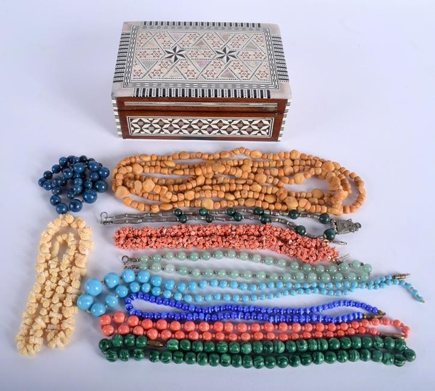 A VINTAGE BOX together with various necklaces. (qty)