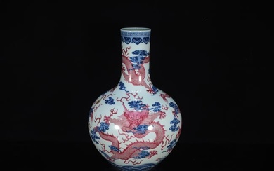 A Very Rare and Fine Blue and White Red Glazed 'Dragon' Bottle Vase