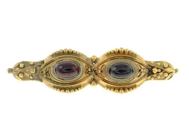 A Victorian garnet brooch.