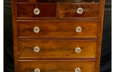 A Victorian mahogany chest of drawers, D-shaped top, above a...