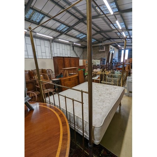 A Victorian style brass four poster double bed frame, with a...
