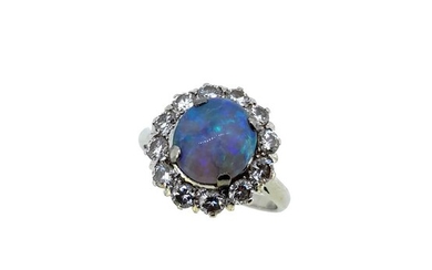 A black opal and diamond cluster ring