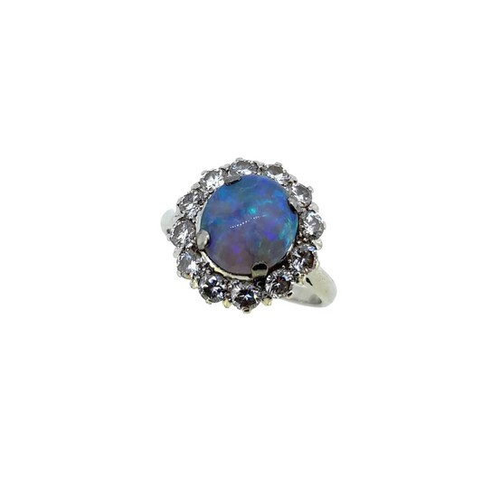 A black opal and diamond cluster ring