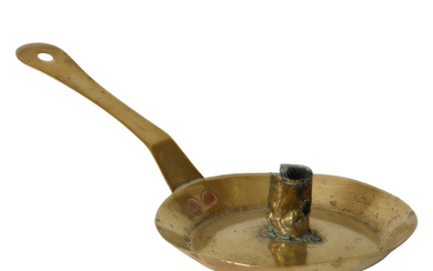 A brass candlestick, 18th century.