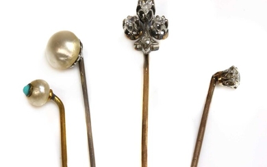 A cased diamond set fleur-de-lys stick pin, early 20th century