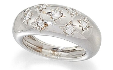 A diamond gypsy-set ring, the seven brilliant-cut...