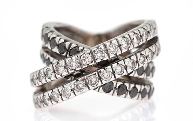SOLD. A diamond ring set with numerous white and black brilliant-cut diamonds, mounted in 18k...