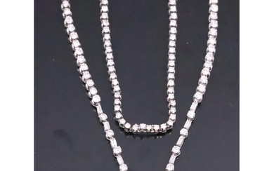 A fine French or Swiss diamond line necklace, set with a lar...