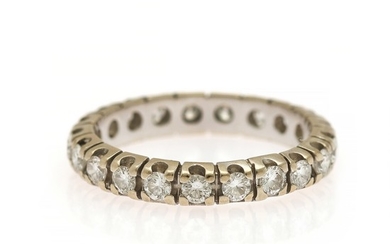 A full eternity ring set with numerous brilliant-cut diamonds, totalling app. 0.94 ct., mounted in 14k white gold. W. 3.6 mm. Size 54.