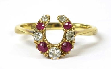 A gold diamond and ruby horseshoe ring