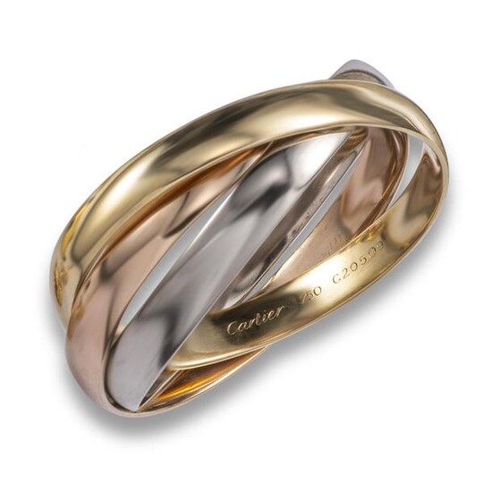 A gold trinity bangle by Cartier, the polished gold connecting bangles are in rose, yellow and white gold, signed and numbered C20509, 5.8cm inner diameter, 80g Accompanied by insurance valuation dated 28 January 1995 from Cartier, London
