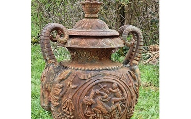 A good quality ornate cast iron garden urn with rams head ha...