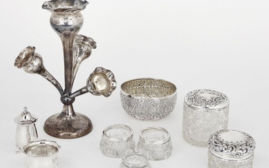 A group of silver and silver mounted items comprising: a four-branch silver epergne, Birmingham, c.1918, Joseph Gloster, base filled, (branches damaged); a pair of silver mounted cut glass salts, London, c.1909, J H Worrall, Son & Co.; a silver...