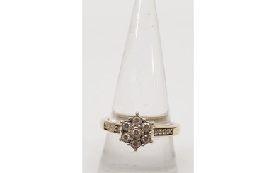 A hallmarked 9ct gold daisy cluster diamond ring totalling ....