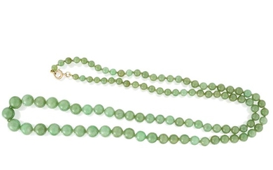 A jadeite jade bead necklace comprised of beads measuring...