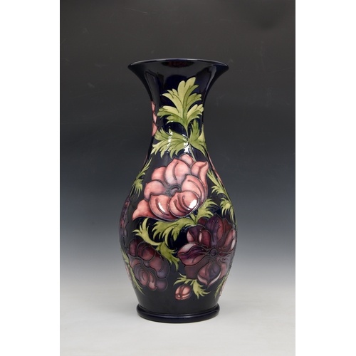 A large Moorcroft Pottery floor standing baluster vase, with...